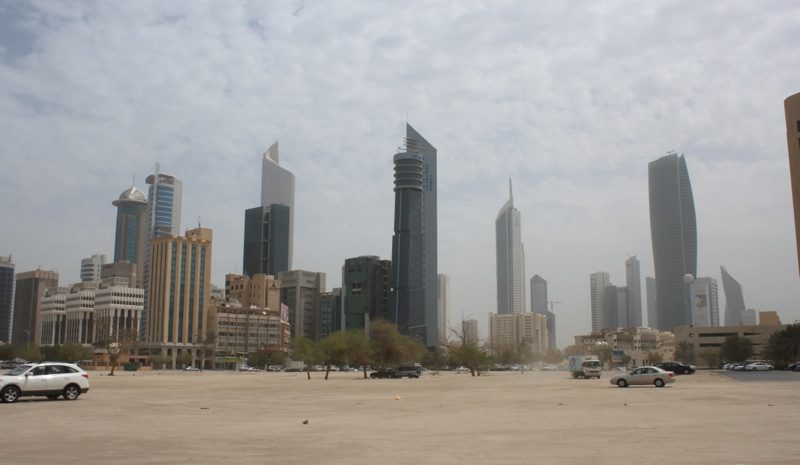 A view of the city skyline from across the street.