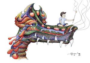 A man sitting on the back of a dragon boat.