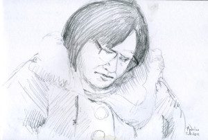 A pencil drawing of a person with glasses