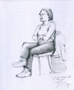 A woman sitting on top of a chair.