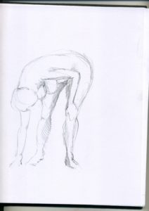 A man bending over and touching his stomach.