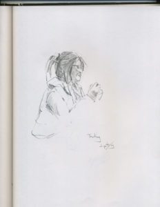 A drawing of a person sitting on the ground